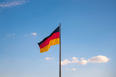 Low angle view of flag against sky