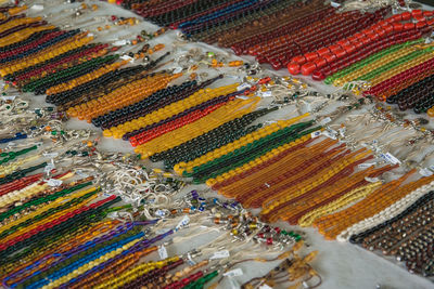High angle view of multi colored necklace at store for sale
