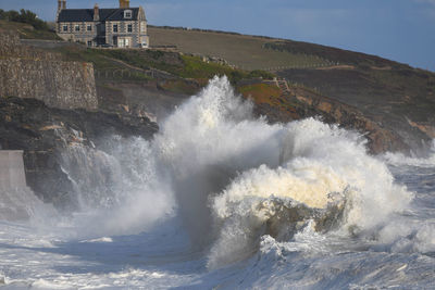 Summer storm in porthleven cornwall at high tide