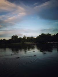 Scenic view of lake at sunset