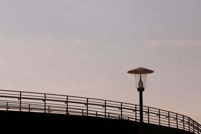 Low angle view of bridge against sky during sunset