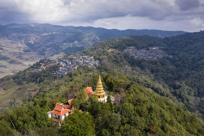 High angle view of buildings and mountains against sky