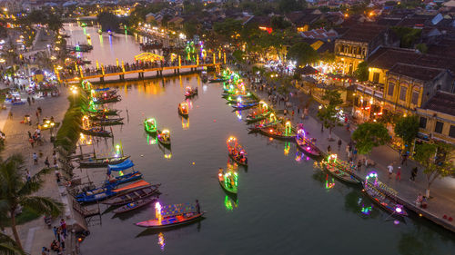 High angle view of boats in river at night