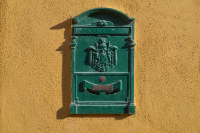 Close-up of mailbox on wall