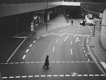 High angle view of people walking on road in city