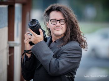 Portrait of woman photographing