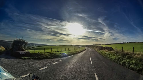 Empty country road along landscape