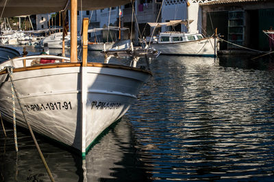 Boats moored at harbor