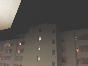 Low angle view of modern building at night