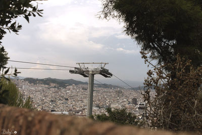 View of city against cloudy sky