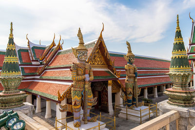 Temple outside building against sky