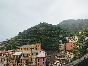 Houses in town against sky