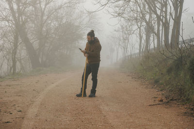 Full length of man walking on field