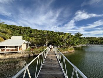 Pier over lake against sky