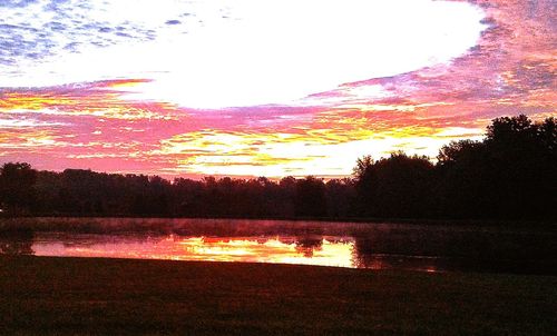 View of lake against cloudy sky during sunset