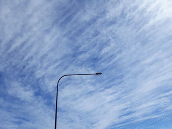 Low angle view of street light against sky