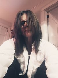 Portrait of young woman at home