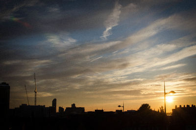 Silhouette of city at sunset