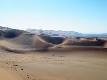 Scenic view of desert against clear sky