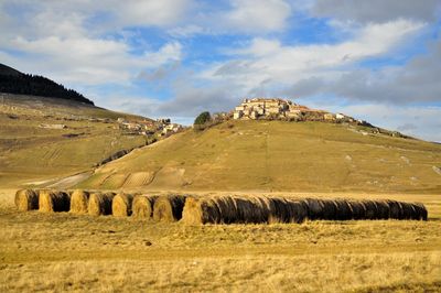 Scenic view of mountains against cloudy sky