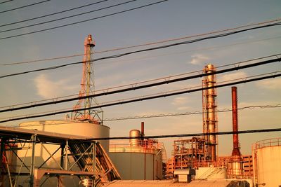 Low angle view of factory against sky