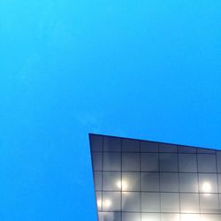 Low angle view of built structure against clear blue sky