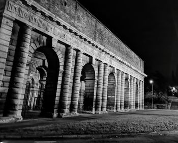 Low angle view of historical building at night