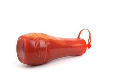High angle view of red wine against white background