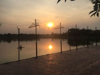 Scenic view of lake against sky during sunset