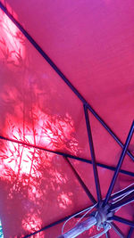 Low angle view of pink and trees against sky