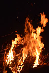 Close-up of fire burning at night