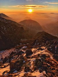 Scenic view of mountains against sky during sunset