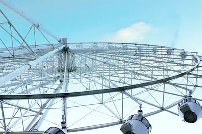 Low angle view of ferries wheel against sky