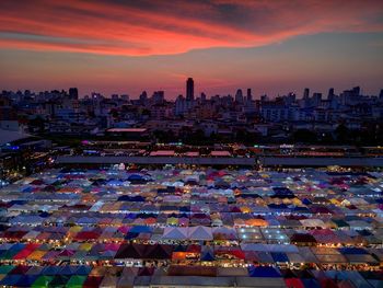 High angle view of buildings in city during sunset