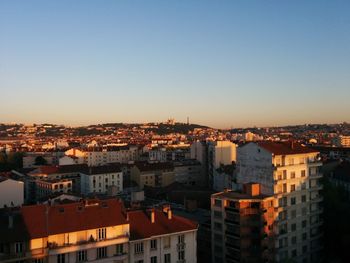 Cityscape against sky during sunset