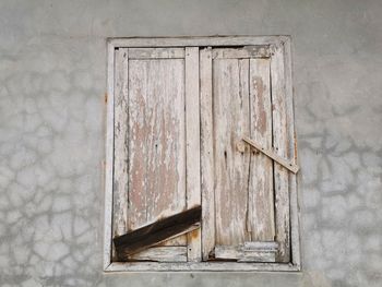 Close-up of old wooden door of building