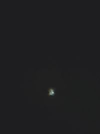 Low angle view of moon against sky at night