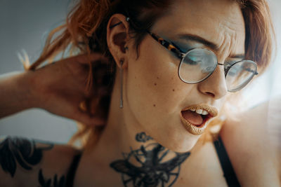 Close-up of young woman wearing sunglasses