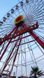 Low angle view of ferris wheel against sky