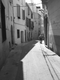 Rear view of man walking on street