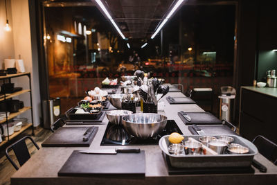 Kitchenware and fresh ingredients placed on table in restaurant kitchen during cooking lesson in navarre, spain