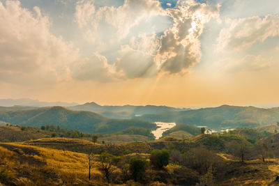 Scenic view of landscape against sky during sunset