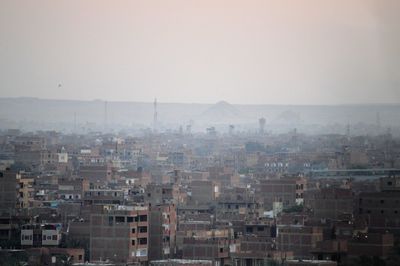 High angle view of buildings against sky in city