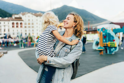 Happy woman standing in city