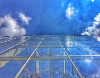 Low angle view of building against cloudy sky