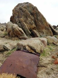 Close-up of stone wall against sky