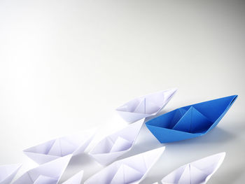 Close-up of multi colored umbrella against white background