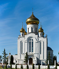Low angle view of church against blue sky