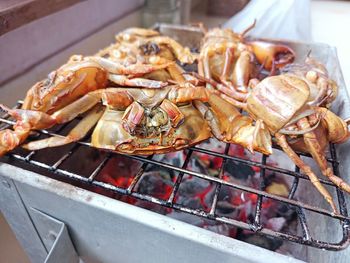 High angle view of meat on barbecue grill