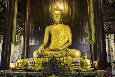 Statue of buddha outside building